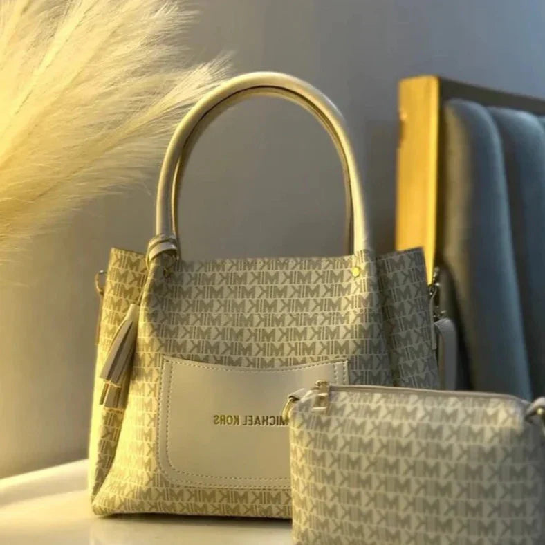 Collection of Michael Kors handbags with a neutral background