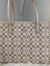 Beige handbag with a pattern on a light gray background