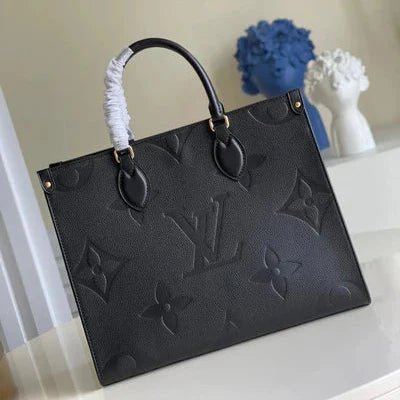 Black handbag with brand logo on a light surface