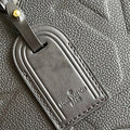 Louis Vuitton luggage tag on a textured surface