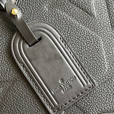 Louis Vuitton luggage tag on a textured surface