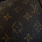 Close-up of a Louis Vuitton monogram pattern on a product.